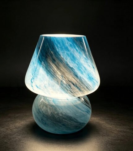 Blue glass mushroom lamp turned on